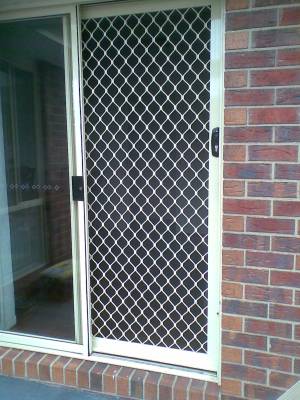 CB: 24 Standard Diamond Pattern Sliding Screen Door Installed On The Inside