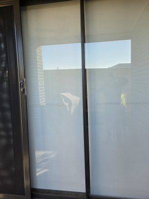 Cb: 82 Stacker Sliding Security Doors Fitted With Stainless Steel Mesh. Displaying The Two Security Doors In A Open Position.