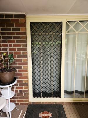 CB: 66 Standard Diamond Black Grille in Primrose Frame With Tuff Screen Aluminium Mesh Sliding Screen Door.