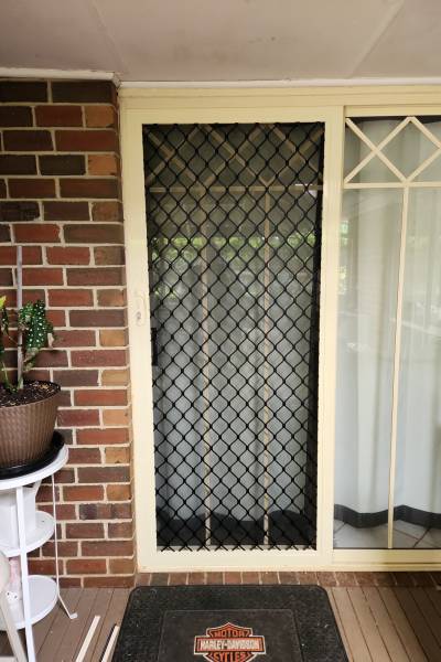 CB: 66 Standard Diamond Black Grille in Primrose Frame With Tuff Screen Aluminium Mesh Sliding Screen Door.
