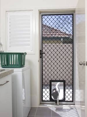Standard diamond hinged door with pet door inside view.